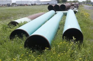 FILE - Pipeline used to carry crude oil sits at the Superior, Wis., terminal of Enbridge Energy, June 29, 2018. An attorney for energy company Enbridge worked Thursday, Feb. 8, 2024, to persuade a federal appellate court to vacate an order to shut down a portion of a pipeline that runs through a Wisconsin tribal reservation within three years. (AP Photo/Jim Mone, File)