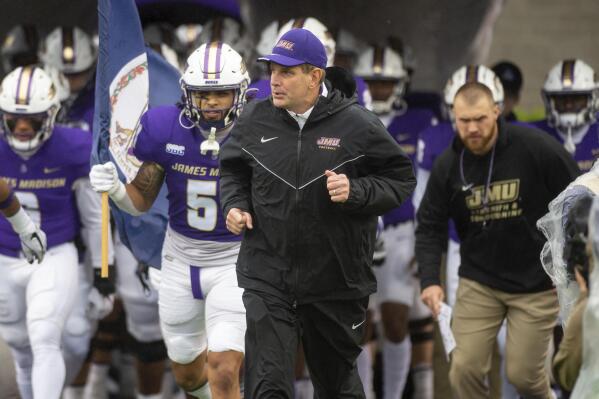 James Madison head coach Curt Cignetti leads his team out of the tunnel as they take the field before of an NCAA football game against Texas State in Harrisonburg, Va., Saturday, Oct. 1, 2022. (Daniel Lin/Daily News-Record Via AP)