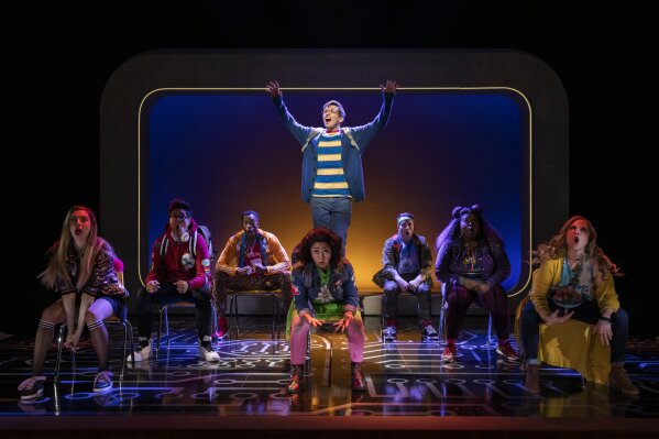
              This image released by Keith Sherman & Associates shows the cast during a performance of the musical "Be More Chill," in New York. Based on the 2004 book by Ned Vizzini, “Be More Chill” tells the story of an awkward teen, played onstage by Will Roland, whose life transforms when he swallows a tiny computer that gives him the confidence to break out of his shell. (Maria Baranova/Keith Sherman & Associates via AP)
            