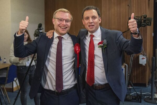 Scottish Labour leader Anas Sarwar, right, with candidate Michael Shanks after Labour won the Rutherglen and Hamilton West by-election, at South Lanarkshire Council Headquarters in Hamilton, Friday Oct. 6, 2023. The seat was vacated after former SNP MP Margaret Ferrier was ousted in a recall petition. Ferrier was kicked out of the SNP for breaching Covid regulations by travelling between London and Glasgow after testing positive for the virus. (Jane Barlow/PA via AP)