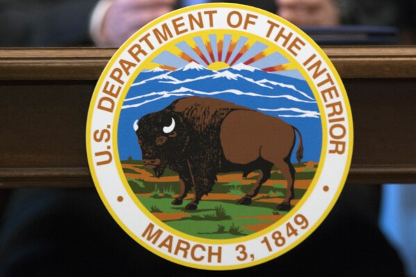 FILE - The Interior Department in Washington, March 29, 2017. The Interior Department will be allocating more than $120 million to tribal governments to fight the impacts of climate change. The funding is designed to help tribal nations adapt to climate threats, including relocating infrastructure. (AP Photo/Molly Riley)