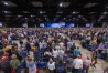 Messengers stand for worship during a Southern Baptist Convention annual meeting Tuesday, June 11, 2024, in Indianapolis. (AP Photo/Doug McSchooler)