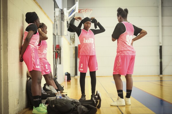 Players prepare before a women's basketball tournament where players can wear a headscarf, in Aubervilliers near Paris, Sunday, April 27, 2025. (AP Photo/Thomas Padilla)