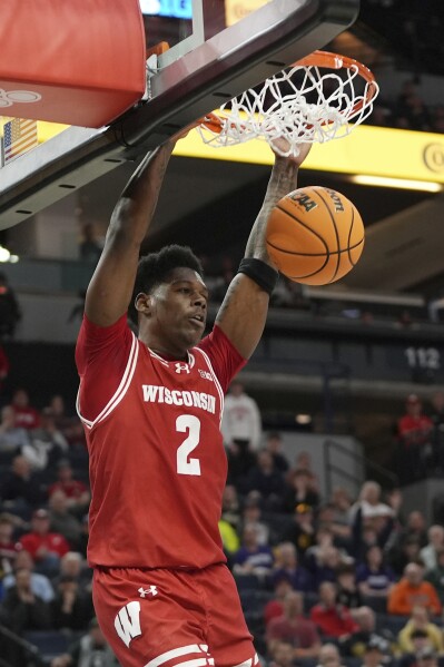 Wisconsin guard AJ Storr dunks during the second half of an NCAA college basketball game against Northwestern in the quarterfinal round of the Big Ten Conference tournament, Friday, March 15, 2024, in Minneapolis. (AP Photo/Abbie Parr)