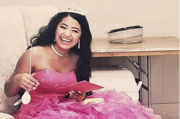 In this February 2021 photo provided by Caring Place@ Miami Rescue Mission, Adriana Palma wears a tiara and ballgown on her quinceanera, her 15th birthday celebration. Quinceaneras are revered in Hispanic culture and celebrated with all the gusto of a wedding. But after her father lost his job, Adriana said, “I lost all hope of having one.” (Caring Place@ Miami Rescue Mission via AP)