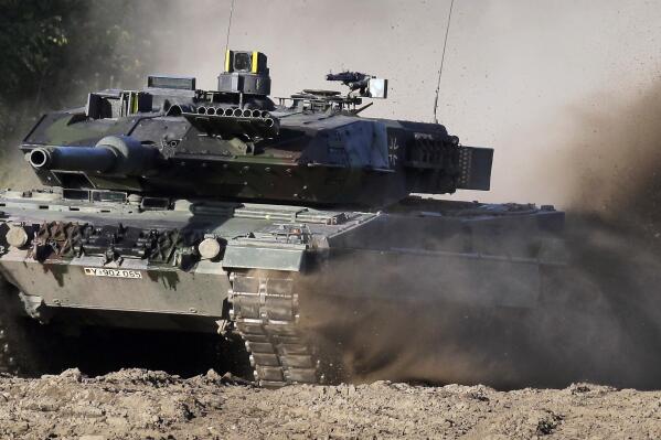 FILE -- A Leopard 2 tank is pictured during a demonstration event held for the media by the German Bundeswehr in Munster near Hannover, Germany, Wednesday, Sept. 28, 2011. The German government has confirmed it will provide Ukraine with Leopard 2 battle tanks and approve requests by other countries to do the same. Chancellor Olaf Scholz said Wednesday that Germany was “acting in close coordination” with its allies. (AP Photo/Michael Sohn, File)