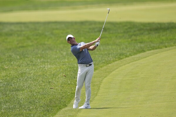 Rory McIlroy, of Northern Ireland, watches his shot on the sixth hole during the final round of the Truist Championship golf tournament at the Philadelphia Cricket Club, Sunday, May 11, 2025, in Flourtown. (AP Photo/Matt Rourke)