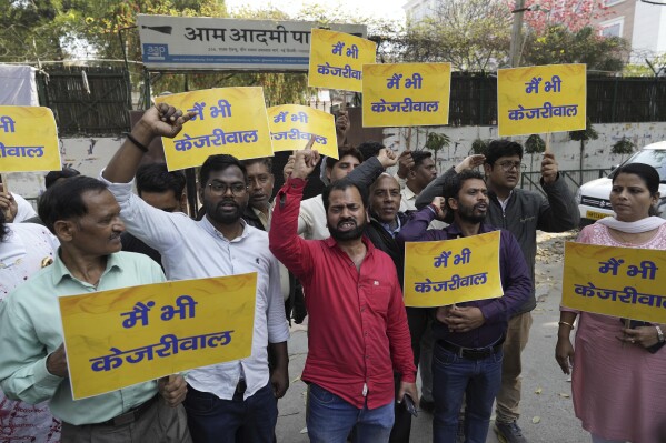 Supporters of the Aam Aadmi Party, or Common Man's Party, shout protest slogans outside the office of India's ruling Bharatiya Janata Party in New Delhi, India, Friday, March 22, 2024. Anti-corruption crusader and AAP leader Arvind Kejriwal was arrested Thursday by the federal investigative agency for suspected financial crimes, which accused his party and ministers of accepting 1 billion rupees ($12 million) in bribes from liquor contractors nearly two years ago, his party said, adding a fresh challenge for India's opposition ahead of general elections. (AP Photo/Manish Swarup)