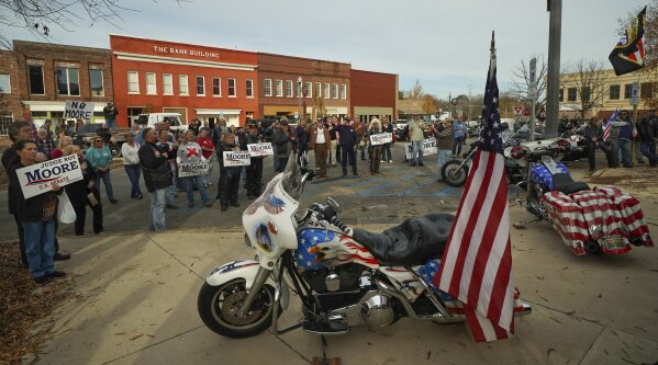 
              Bikers For Trump hold a rally for Alabama Chief Justice and U.S. Senate candidate Roy Moore at Jackson County Courthouse Square in Scottsboro, Ala., Sunday, Dec. 3, 2017. (Bob Gathany/AL.com via AP)
            