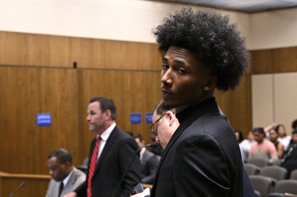 FILE - Mikey Williams stands in court Oct. 27, 2023, in El Cajon, Calif. Williams pleaded guilty to one felony charge in a gun case Thursday, Nov. 30, and one of his attorneys said he does not expect the 19-year-old to face jail time. Williams had faced nine felony counts and up to 30 years in prison stemming from a shooting at his home on March 17 in which no one was injured. Williams pleaded guilty to one felony count of making a criminal threat and to a special allegation of using a firearm during the threat, attorney Randy M. Grossman said. (AP Photo/Orlando Ramirez, File)