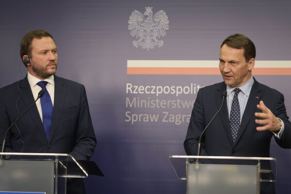 Poland's Foreign Minister Radek Sikorski, right, and Estonia's Foreign Minister Margus Tsahkna address reporters following their talks on regional security and continuing support for Ukraine in its struggle against Russia's invasion, at the Foreign Ministry in Warsaw, Poland, Wednesday Feb. 14, 2024. Estonia's foreign minister said Wednesday that NATO has about three or four years to beef up its defenses against Russia because President Vladimir Putin is ramp up his country's “war machine