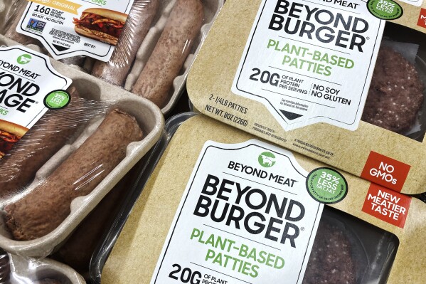 FILE - Beyond Meat products are seen in a refrigerated case inside a grocery store in Mount Prospect, Ill., Feb. 19, 2022. eyond Meat has reported higher-than-expected sales in the fourth quarter, despite weak U.S. demand. The plant-based meat maker said its revenue for the October-December 2023 period fell 8% to $73.7 million. (AP Photo/Nam Y. Huh, File)