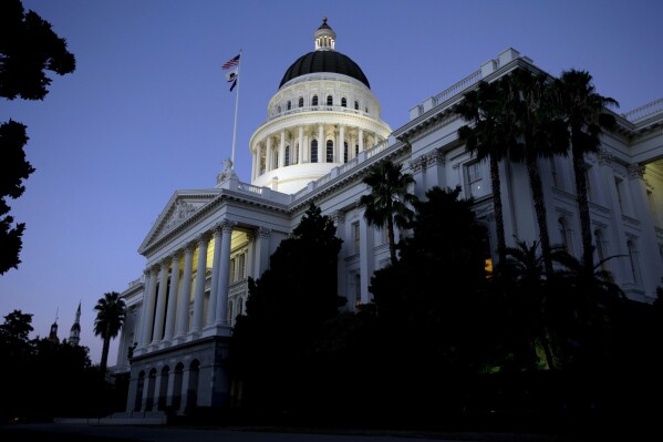 FILE - The dome of the California Capitol glows in the early evening, Aug. 31, 2016, in Sacramento, Calif. On Friday, Sept. 8, 2023, Democratic California lawmakers approved a bill that would instruct courts to consider, among many other factors, whether a parent affirms a child’s gender identity when making custody and visitation decisions. But critics online are claiming that the measure goes much further, and means any parent who doesn’t support their kid’s desire to pursue gender-affirming surgery will lose custody. (AP Photo/Rich Pedroncelli, File)