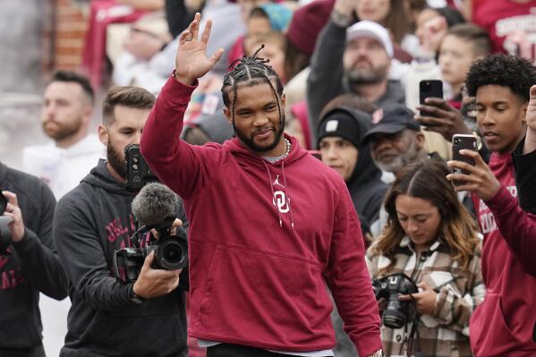 Former Oklahoma quarterback and 2018 Heisman Trophy winner Kyler Murray waves as he is introduced during halftime of the NCAA college football team's spring game Saturday, April 22, 2023, in Norman, Okla. (AP Photo/Sue Ogrocki)