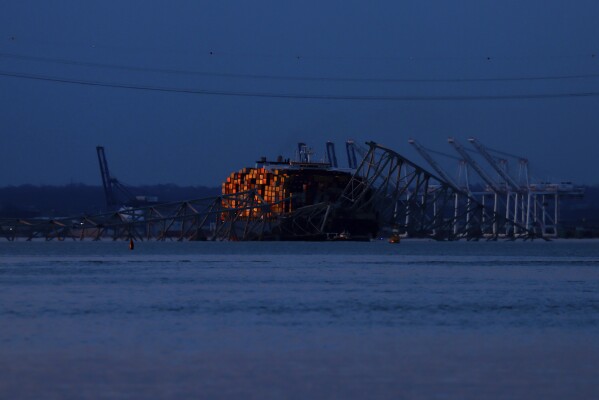 Wreckage of the Francis Scott Key Bridge rests on the container ship Dali, Sunday, March 31, 2024, in Baltimore. (AP Photo/Julia Nikhinson)