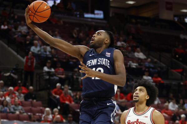 Penn State guard Evan Mahaffey, left, shoots in front of Ohio State forward Justice Sueing during the first half of an NCAA college basketball game in Columbus, Ohio, Thursday, Feb. 23, 2023. (AP Photo/Paul Vernon)