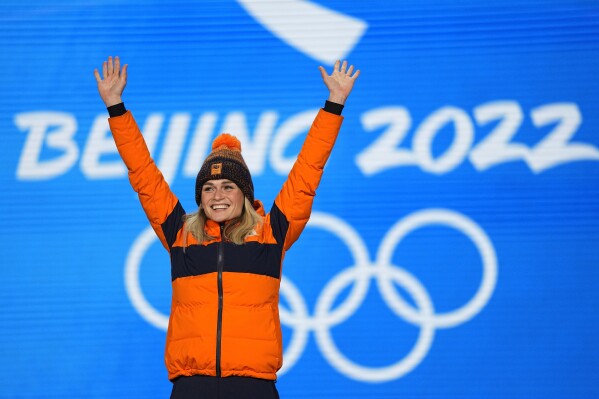 FILE - Gold medalist Irene Schouten, of the Netherlands, poses for a photo during a medals ceremony for the for the women's speedskating 3,000-meter race of the 2022 Winter Olympics, on Feb. 6, 2022, in Beijing. The favored French candidacy to host the 2030 Winter Olympics is in talks with the Netherlands and Italy to stage speedskating races there. The IOC’s executive director of the Olympic Games, Christophe Dubi, suggested France's neighbors Italy — which will host the 2026 Winter Games in Milan and Cortina d’Ampezzo — and the Netherlands, a longtime power in speed skating. The Dutch team won six speedskating gold medals at the 2022 Beijing Olympics, including three for Irene Schouten. (AP Photo/Jae C. Hong, File)