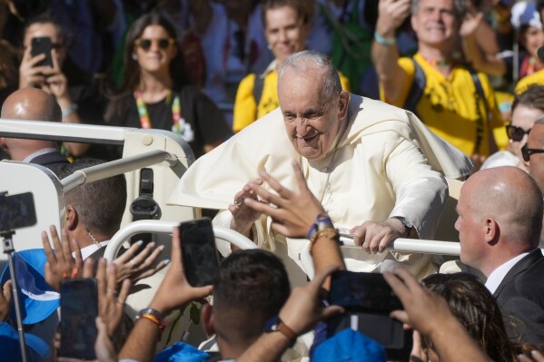 Pope Francis arrives as he attends a gathering at the "Eduardo VII Park" with young people participating into the 37th World Youth Day, in Lisbon, Thursday, Aug. 3, 2023. Pope Francis is on his second day of a five-day pastoral visit to Portugal that includes the participation at the 37th World Youth Day, and a pilgrimage to the holy shrine of Fatima. (AP Photo/Gregorio Borgia)
