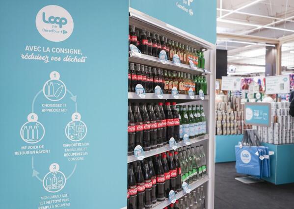 This photos provided by North America Public Relations shows Loop reusable packaging at French supermarket.  Reusable packaging is about to become more common at groceries and restaurants worldwide. Loop, which collects and sanitizes reusable containers, said Wednesday, Sept. 22, 2021 it’s expanding after successful trials in France and Japan.  Kroger and Walgreens in the U.S., and Tesco in the United Kingdom are among the groceries partnering with Loop. McDonald’s, Burger King and Tim Hortons have also signed on.   (North America Public Relations via AP)