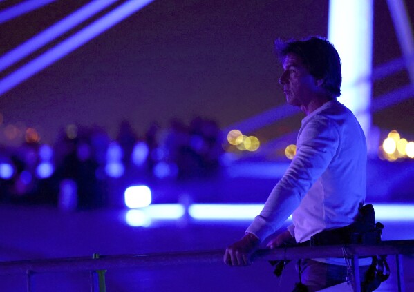 Actor Tom Cruise is pictured on the roof of the Stade de France during the closing ceremony of the 2024 Summer Olympics, Sunday, Aug. 11, 2024, in Saint-Denis, France. (Fabrizio Bensch/Pool Photo via AP)
