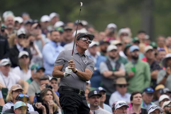 Phil Mickelson follows his shot on the 12th hole during a practice for the Masters golf tournament at Augusta National Golf Club, Tuesday, April 4, 2023, in Augusta, Ga. (AP Photo/Mark Baker)