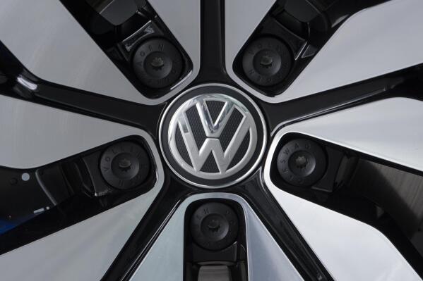 FILE - An e-Golf electric car with the VW logo on a rim is pictured in the German car manufacturer Volkswagen Transparent Factory (Glaeserne Manufaktur) in Dresden, eastern Germany, April 28, 2017. Volkswagen announced Monday, March 13, 2023, it plans to build a major plant for electric vehicle batteries in Canada. The start of production is planned for 2027. (AP Photo/Jens Meyer, File)