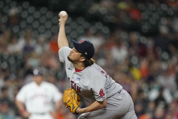 Boston Red Sox relief pitcher Hirokazu Sawamura throws during the