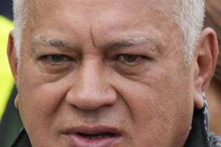 Venezuelan Interior Minister Diosdado Cabello speaks to the press during the arrival of Venezuelan migrants returning from Mexico, at the Simon Bolivar International Airport in Maiquetia, March 20, 2025. (AP Photo/Ariana Cubillos, File)