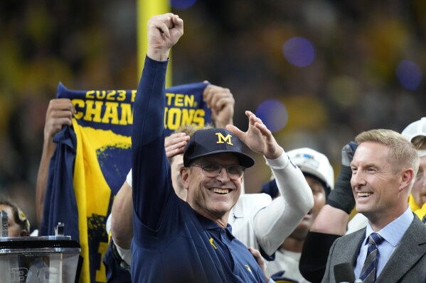 Michigan head coach Jim Harbaugh celebrates after the Big Ten championship NCAA college football game against Iowa, Saturday, Dec. 2, 2023, in Indianapolis. Michigan won 26-0. (AP Photo/AJ Mast)