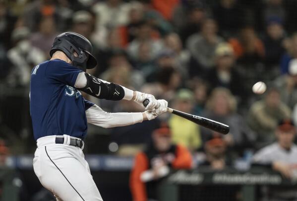 Seattle Mariners' Jessie Winker hits a two-run double off Baltimore Orioles relief pitcher Felix Bautista during the eighth inning of a baseball game Tuesday, June 28, 2022, in Seattle. (AP Photo/Stephen Brashear)
