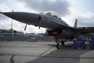 FILE - U.S. Air Force F-16 fighter jet is on display during the Paris Air Show in Le Bourget, north of Paris, France, Monday, June 19, 2023. The U.S. is beefing up its use of fighter jets around the strategic Strait of Hormuz to protect ships from Iranian seizures, a senior defense official said Friday, July 14, adding that the U.S. is increasingly concerned about the growing ties between Iran, Russia and Syria across the Middle East. (AP Photo/Lewis Joly, File)