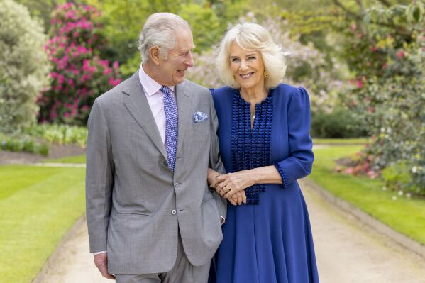 Britain's King Charles III and Queen Camilla stand in Buckingham Palace Gardens on Wednesday April 10, 2024, the day after their 19th wedding anniversary. This photo is being released on Friday, April 26, 2024, to mark the first anniversary of their Coronation. Buckingham Palace says King Charles III will resume his public duties next week following treatment for cancer. The announcement on Friday April 26, 2024, comes almost three months after Charles took a break from public appearances to focus on his treatment for an undisclosed type of cancer. (Millie Pilkington/Buckingham Palace via AP)