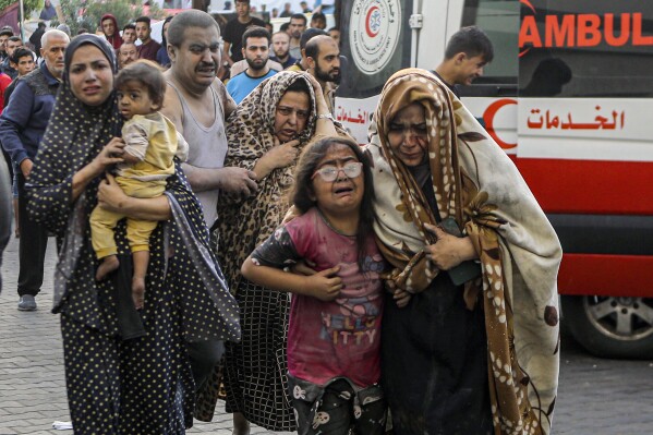 Injured Palestinians arrive at al-Shifa Hospital following Israeli airstrikes on Gaza City, central Gaza Strip, Monday, Oct. 16, 2023. (AP Photo/Abed Khaled)