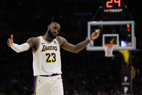 Los Angeles Lakers forward LeBron James (23) reacts during the first half of an NBA basketball game against the Indiana Pacers, Sunday, March 24, 2024, in Los Angeles. (AP Photo/Etienne Laurent)