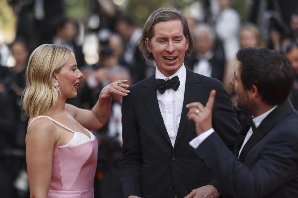 Scarlett Johansson, from left, director Wes Anderson, and Jason Schwartzman pose for photographers upon arrival at the premiere of the film 'Asteroid City' at the 76th international film festival, Cannes, southern France, Tuesday, May 23, 2023. (Photo by Vianney Le Caer/Invision/AP)