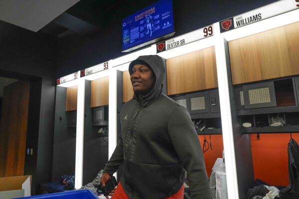 Chicago Bears defensive tackle Gervon Dexter Sr. cleans out his locker at Halas Hall a day after the team's last game of the season against Green Bay, Monday, Jan. 6, 2025, in Chicago. (AP Photo/Erin Hooley)