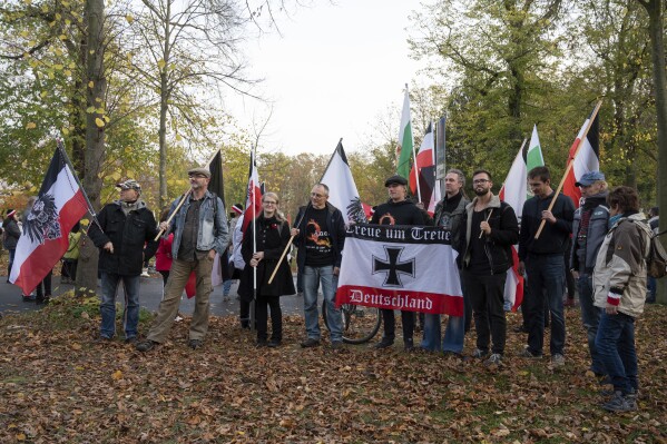 Participants of a demonstration of Reich citizens carry black and white and other flags in Potsdam, Germany, on Nov. 14, 2020. (Christophe Gateau/dpa via AP, File)