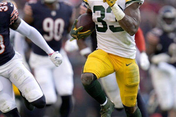 Green Bay Packers running back Aaron Jones heads for the end zone for a touchdown during the second half of an NFL football game against the Chicago Bears Sunday, Sept. 10, 2023, in Chicago. (AP Photo/Erin Hooley)