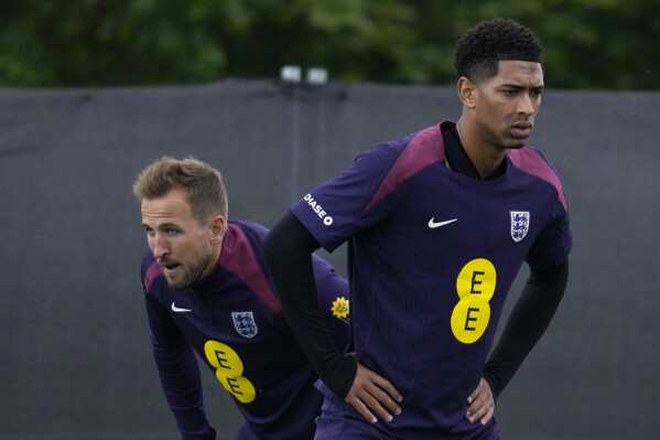 England's Jude Bellingham, right, and Harry Kane practice during a training session in Blankenhain, Germany, Wednesday, June 12, 2024 ahead of their Group C soccer match against Serbia at the Euro 2024 soccer tournament. (AP Photo/Thanassis Stavrakis)