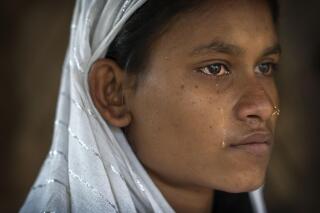 Nureja Khatun, 19, cries as she waits in her shanty home for her husband Akbor Ali to return, in Morigaon district of Indian northeastern state of Assam, Saturday, Feb. 11, 2023. Khatun's husband is one among more than 3,000 men, including Hindu and Muslim priests, who were arrested nearly two weeks ago in the northeastern state of Assam under a wide crackdown on illegal child marriages involving girls under the age of 18. (AP Photo/Anupam Nath)