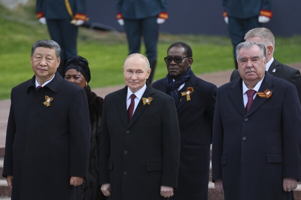 Chinese President Xi Jinping, left, Russian President Vladimir Putin, centre, Tajikistan's President Emomali Rakhmon, right, and President of the Republic of Congo Denis Sassou Nguesso, centre right, attend a wreath laying ceremony at the Tomb of the Unknown Soldier in Alexander Garden after the Victory Day military parade in Moscow, Russia, Friday, May 9, 2025, during celebrations of the 80th anniversary of the Soviet Union's victory over Nazi Germany during the World War II. (Yuri Kochetkov/Pool Photo via AP)