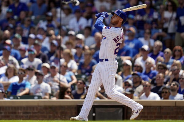Chicago Cubs' Cody Bellinger hits a two-run home run during the first inning of a baseball game against the Kansas City Royals, Saturday, Aug. 19, 2023, in Chicago. (AP Photo/Erin Hooley)