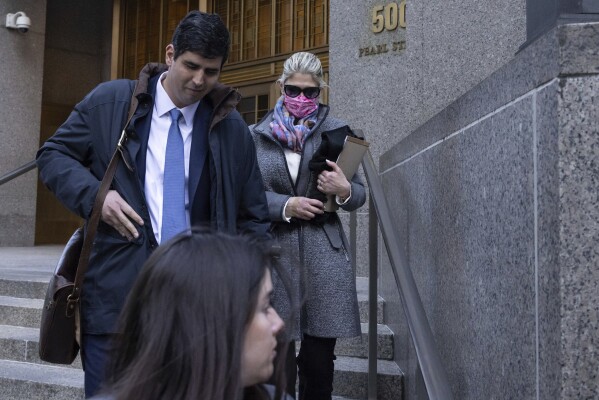 Nadine Menendez, back right, wife of former U.S. Sen. Bob Menendez, leaves Manhattan federal court, Tuesday, March 18, 2025, in New York. (AP Photo/Yuki Iwamura)