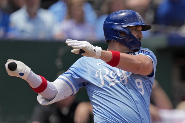 Kansas City Royals' Vinnie Pasquantino watches his RBI sacrifice fly during the fourth inning of a baseball game against the San Diego Padres Sunday, June 2, 2024, in Kansas City, Mo. (AP Photo/Charlie Riedel)