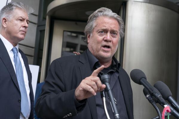 Steve Bannon accompanied by his attorney M. Evan Corcoran, speaks to the media as he departs the federal court in Washington, Thursday, July 21, 2022. Bannon was brought to trial on a pair of federal charges for criminal contempt of Congress after refusing to cooperate with the House committee investigating the U.S. Capitol insurrection on Jan. 6, 2021. (AP Photo/Jose Luis Magana)