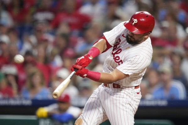 Philadelphia Phillies' Kyle Schwarber hits a three-run home run against Miami Marlins pitcher Johnny Cueto during the second inning of a baseball game, Saturday, Sept. 9, 2023, in Philadelphia. (AP Photo/Matt Slocum)