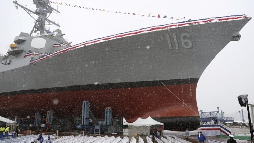 Snow falls on the USS Thomas Hudner, a US Navy destroyer named after a Korean War veteran, during her christening ceremony April 1, 2017, in Bath, Maine.  (AP Photo/Mary Schwalm, File)