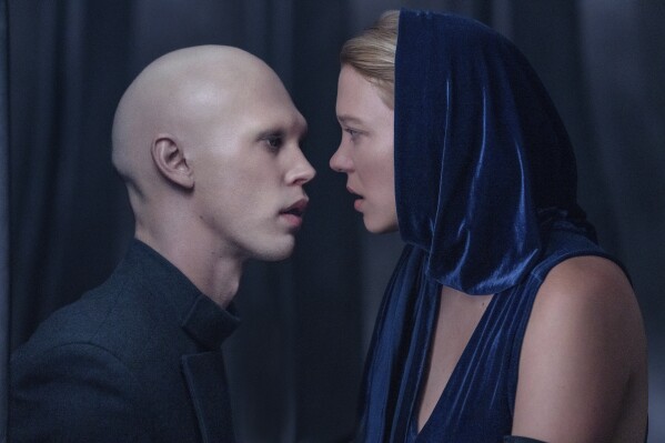 This image released by Warner Bros. Pictures shows Austin Butler, left, and Lea Seydoux in a scene from "Dune: Part Two." (Warner Bros. Pictures via AP)