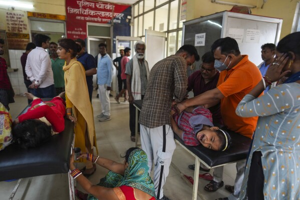 FILE - People suffering from heat related ailments crowd the district hospital in Ballia, Uttar Pradesh state, India, June 20, 2023. The rate Earth is warming hit an all-time high in 2023 with 92% of last year’s surprising record-shattering heat caused by humans, top scientists calculated. (AP Photo/Rajesh Kumar Singh, File)