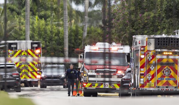 First responders work an active fire inside the Landmark Ranch Estates neighborhood on Wednesday, Jan. 3, 2024, in Southwest Ranches, Fla. Fire rescue crews alongside the Broward Sheriff's Office worked to put out a two-alarm fire at a home belonging to Miami Dolphins wide receiver Tyreek Hill inside the private neighborhood. (Matias J. Ocner/Miami Herald via AP)